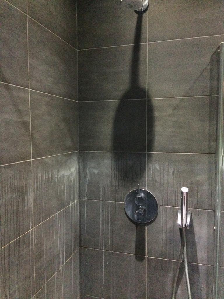 Stained Black Porcelain Shower Tile Cheshunt During Cleaning